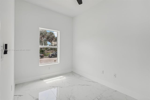 spare room with ceiling fan