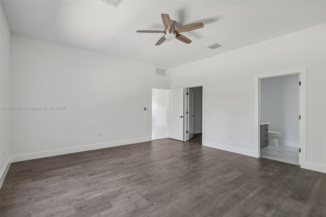 unfurnished bedroom with ensuite bath, ceiling fan, and dark hardwood / wood-style floors