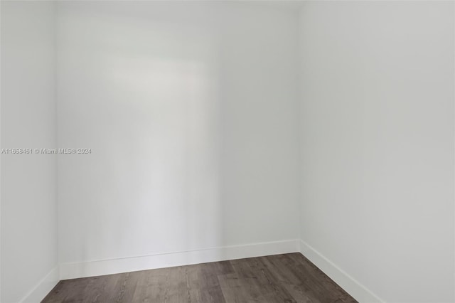 spare room with dark hardwood / wood-style floors