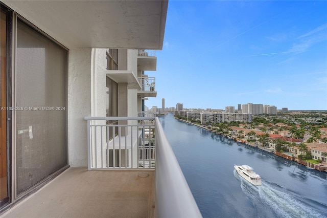 balcony featuring a water view