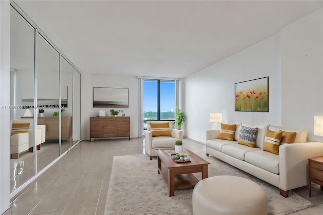 tiled living room with a wall of windows