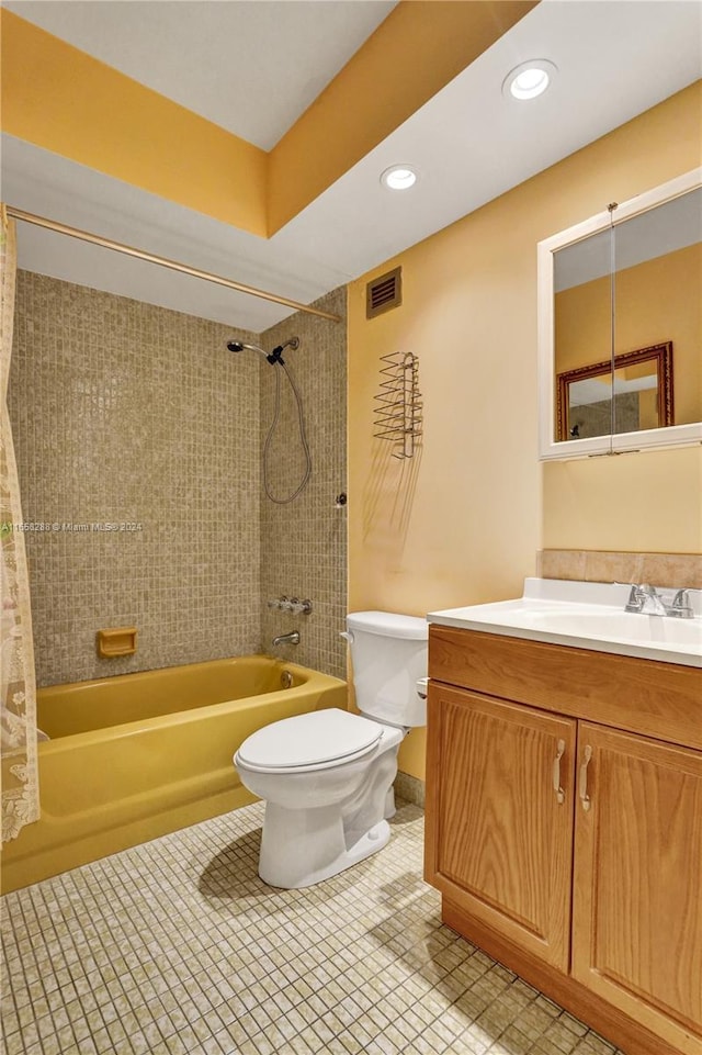 full bathroom featuring tile patterned floors, shower / bath combo, toilet, and vanity