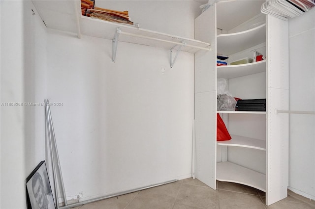 walk in closet featuring light tile patterned floors