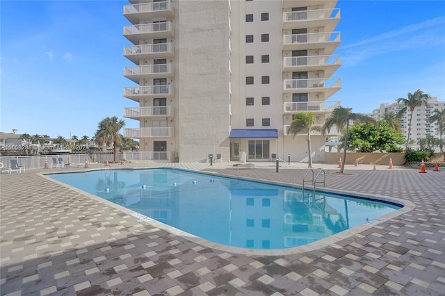 view of swimming pool with a patio area