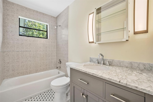 full bathroom with tiled shower / bath combo, vanity, and toilet