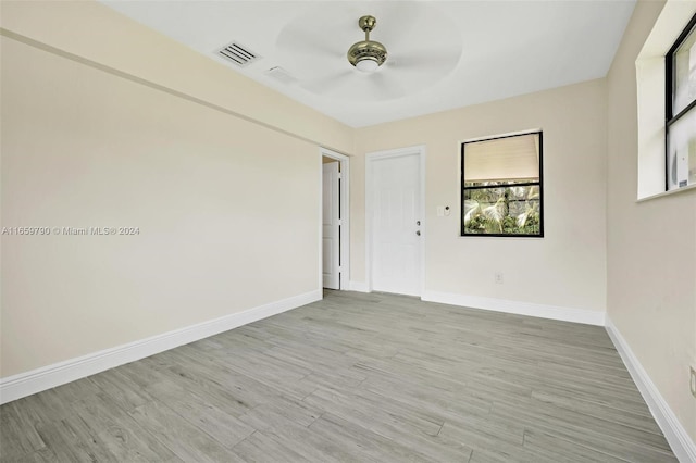 unfurnished room featuring ceiling fan and light hardwood / wood-style floors