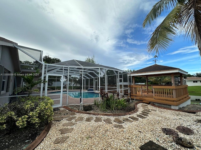 view of pool featuring a lanai, a gazebo, and a patio area