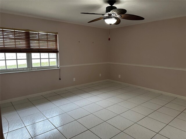 spare room featuring ceiling fan and ornamental molding