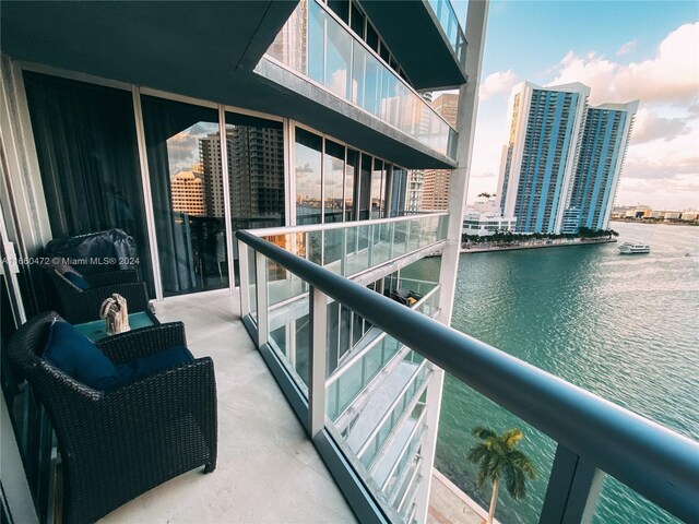 balcony featuring a water view