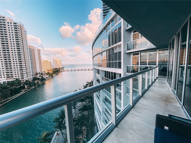 balcony featuring a water view