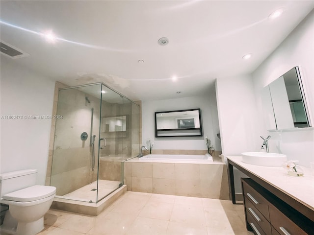 full bathroom with vanity, toilet, separate shower and tub, and tile patterned floors