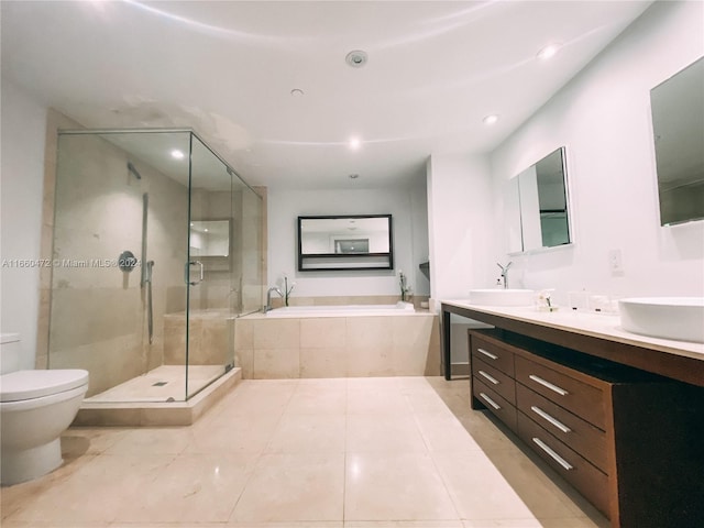 full bathroom with plus walk in shower, tile patterned floors, toilet, and vanity