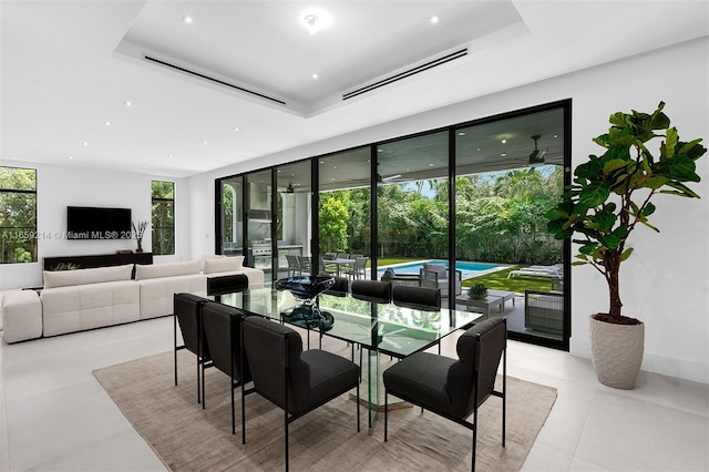 7001 SW 71st Ave, Miami, FL 33143 - dining space with a raised ceiling, light tile patterned floors, and recessed lighting