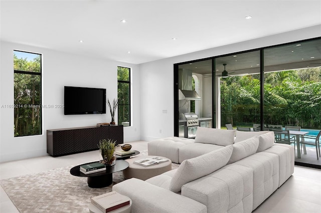 7001 SW 71st Ave, Miami, FL 33143 - tiled living area featuring plenty of natural light, a ceiling fan, and recessed lighting