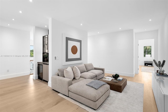 7001 SW 71st Ave, Miami, FL 33143 - living area with light wood finished floors, recessed lighting, a dry bar, and baseboards
