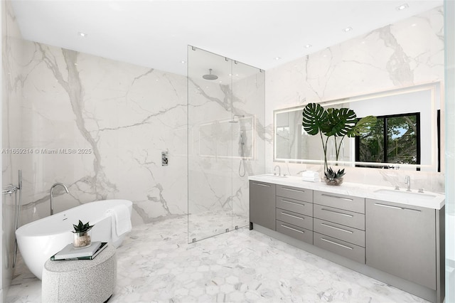 7001 SW 71st Ave, Miami, FL 33143 - bathroom with tile walls, marble tiled flooring, a marble finish shower, stone wall, and a freestanding bath