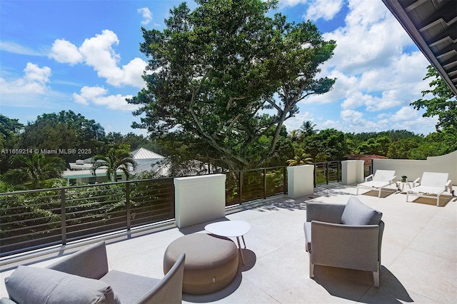 7001 SW 71st Ave, Miami, FL 33143 - view of patio with a balcony and outdoor lounge area