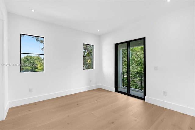 7001 SW 71st Ave, Miami, FL 33143 - spare room featuring healthy amount of natural light, light wood-style floors, baseboards, and recessed lighting
