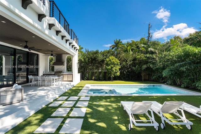 7001 SW 71st Ave, Miami, FL 33143 - view of swimming pool featuring outdoor dining area, a yard, a ceiling fan, and a pool with connected hot tub