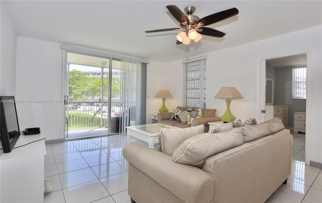 tiled living room with ceiling fan