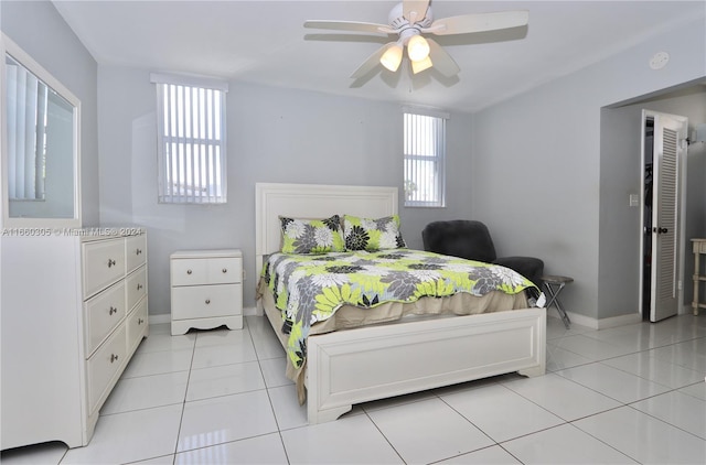 tiled bedroom with ceiling fan