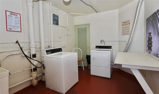 washroom with independent washer and dryer