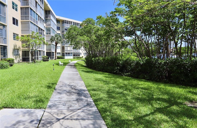 view of community featuring a lawn