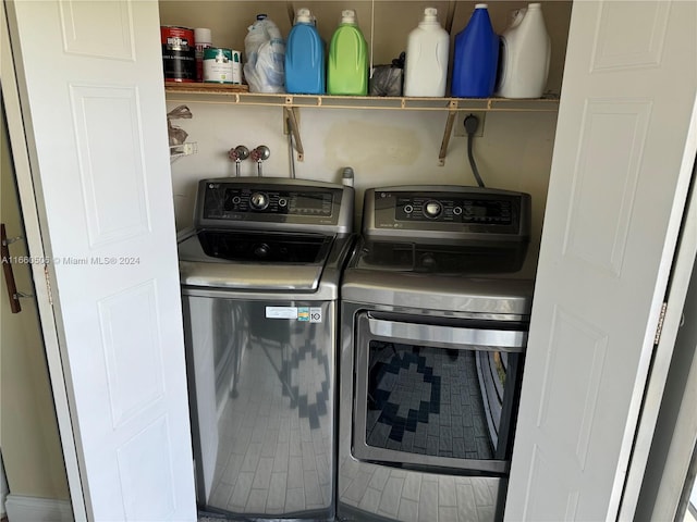 washroom with washer and dryer