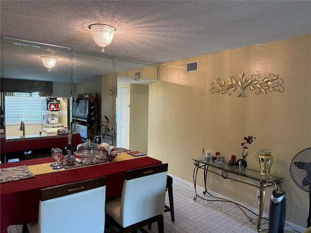 dining room with a textured ceiling