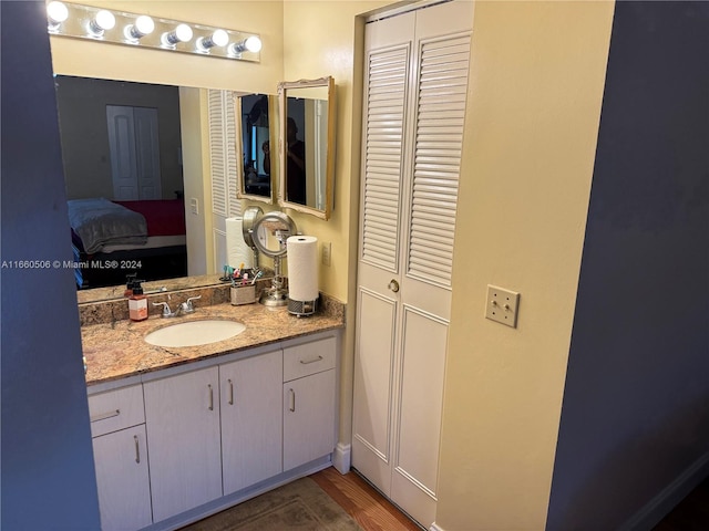 bathroom featuring vanity and hardwood / wood-style floors