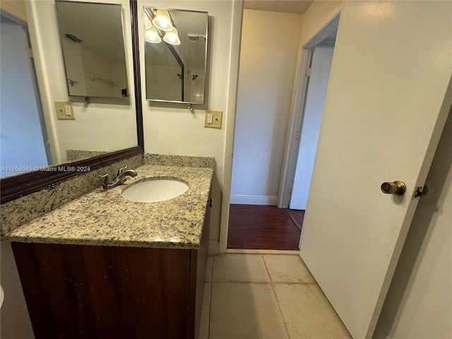 bathroom featuring vanity and hardwood / wood-style flooring