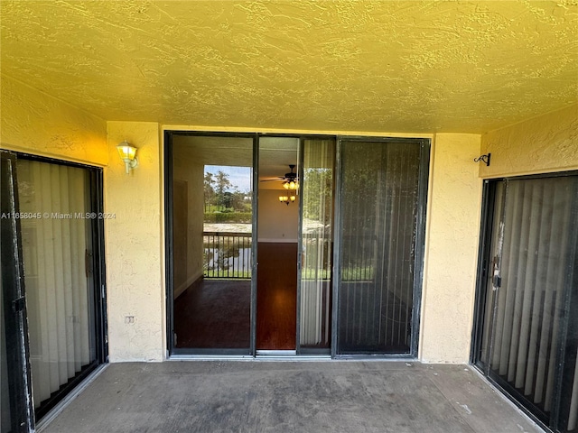 doorway to property with a patio area