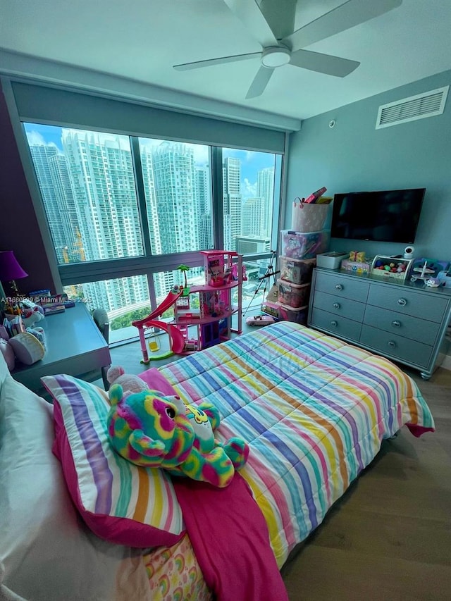 bedroom featuring visible vents and ceiling fan