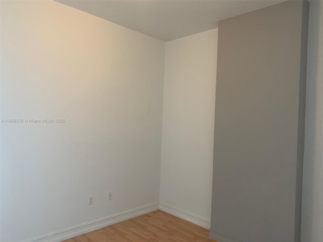 unfurnished bedroom with a closet and light hardwood / wood-style flooring