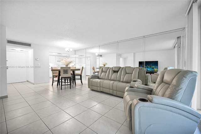 living room with light tile patterned floors and a textured ceiling