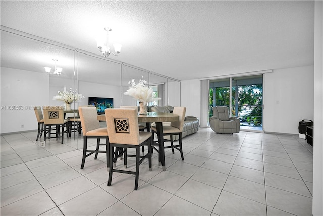 tiled dining area with floor to ceiling windows, a textured ceiling, and an inviting chandelier