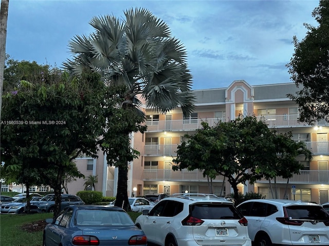 view of outdoor building at dusk