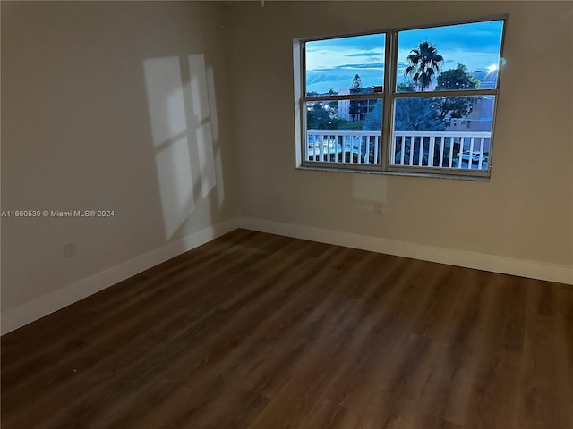 spare room with hardwood / wood-style floors