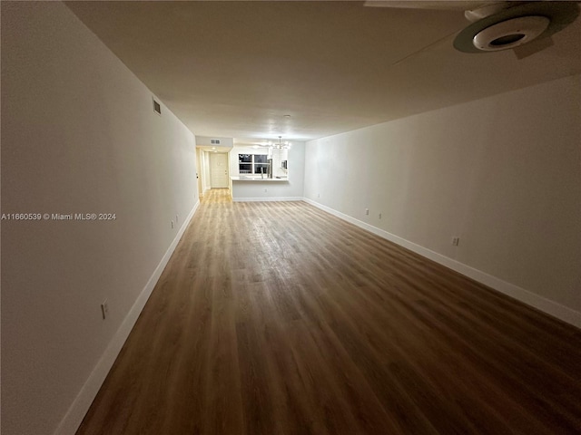 unfurnished living room with dark hardwood / wood-style floors