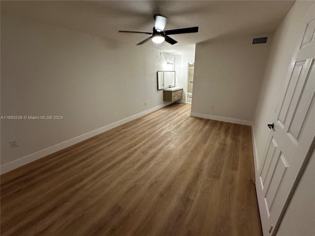 unfurnished living room featuring hardwood / wood-style floors and ceiling fan