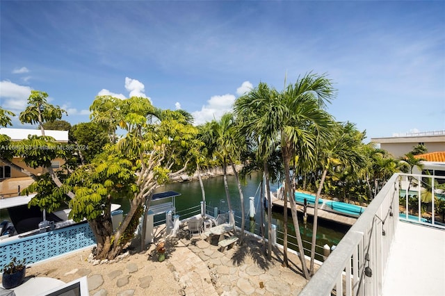 exterior space featuring a water view and a dock