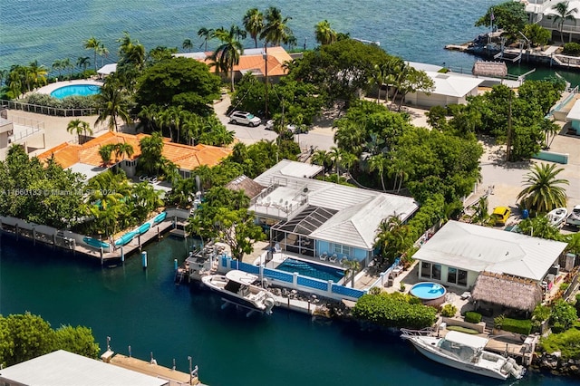 birds eye view of property featuring a water view