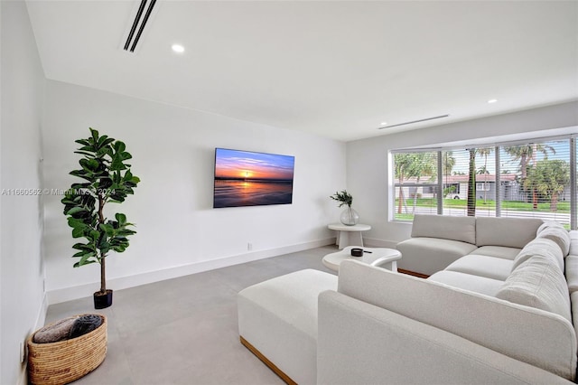 living room with concrete flooring