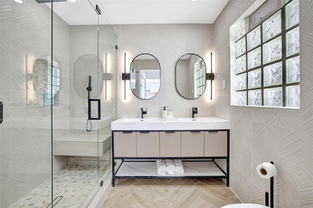 bathroom with vanity and a shower with door