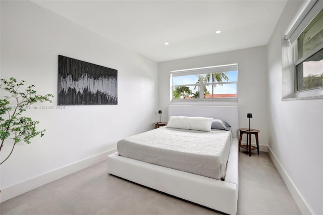 bedroom with concrete floors