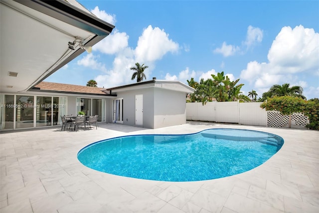 view of swimming pool featuring a patio area