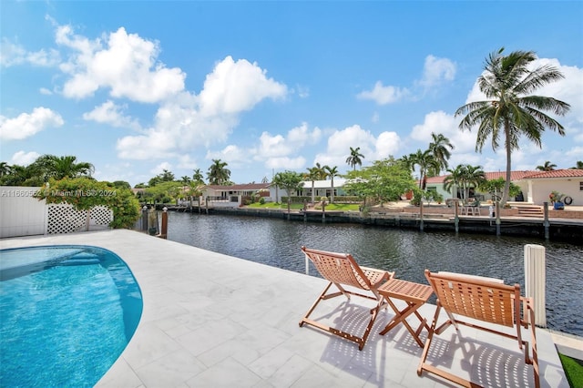 view of pool with a water view