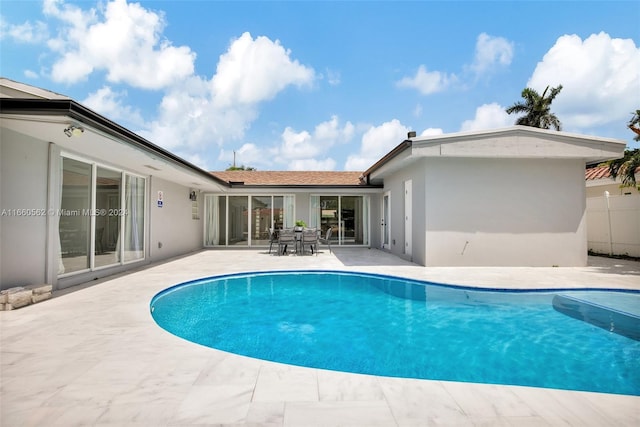 view of pool featuring a patio