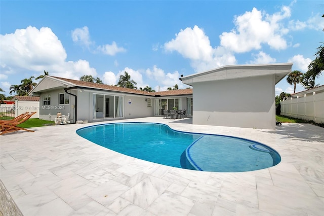 view of swimming pool featuring a patio area