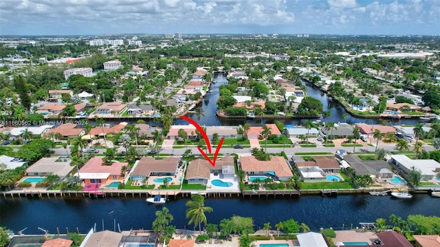 birds eye view of property with a water view